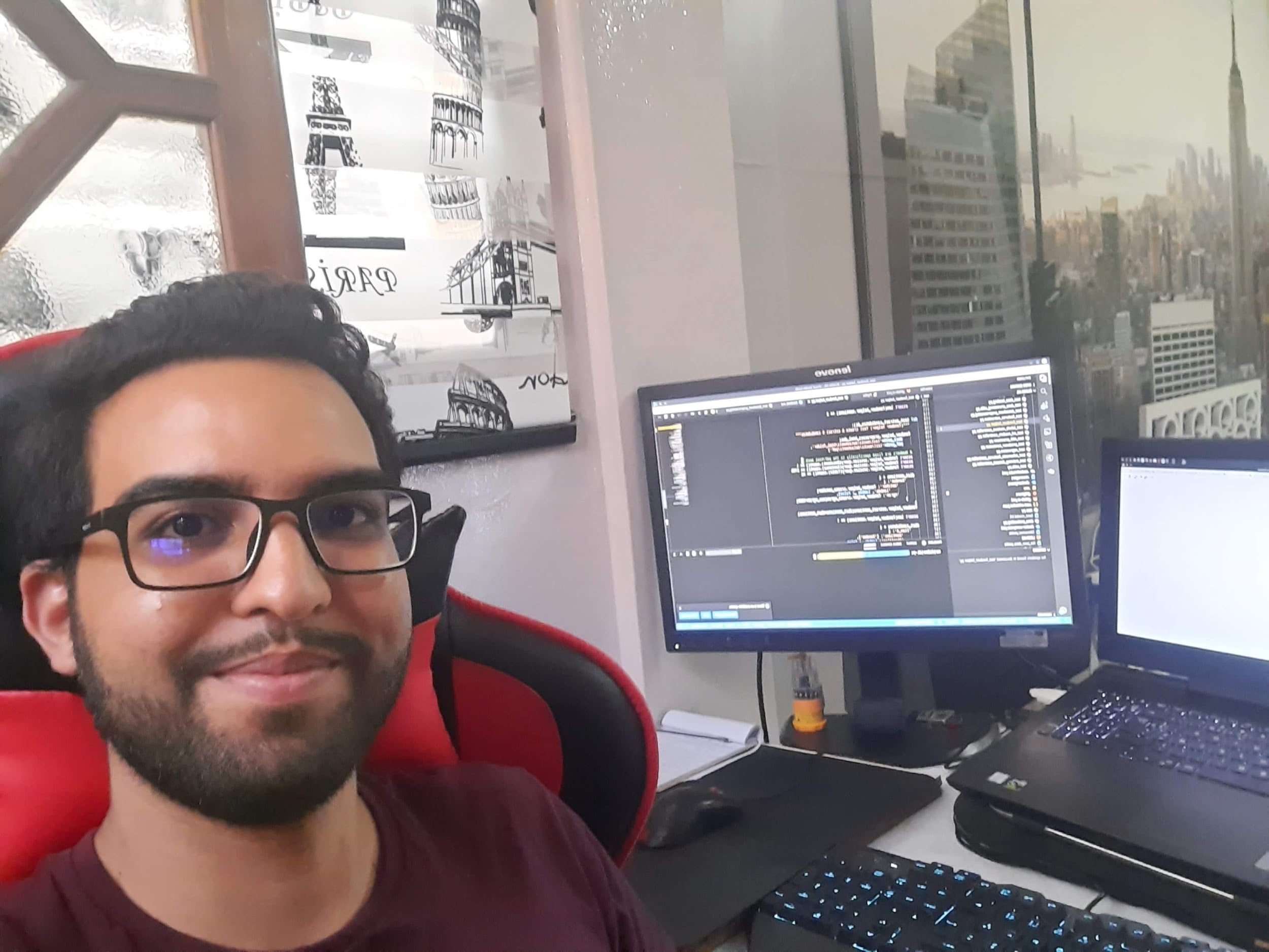 Wajdi in front of his desk
